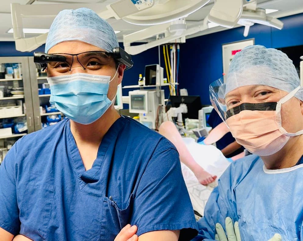 Surgical team using AR smart glasses during an innovative procedure