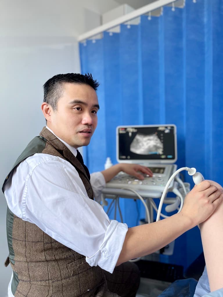 Professor Lee performing an ultrasound assessment during a specialist consultation